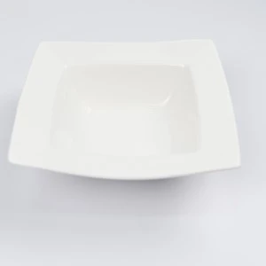 Smooth white ceramic square plate with curved edges and minimalist design for elegant table settings.