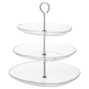 Three-tier glass serving stand with white plates and silver metal support rod for elegant events.