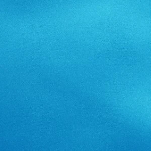 Solid turquoise blue textured background with gradient and smooth fabric-like surface.