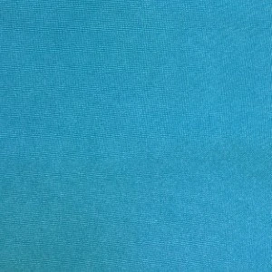 Turquoise blue textured fabric with fine woven surface and consistent color gradient.