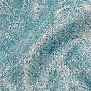 Textured aqua blue and gray fabric with swirling, rippled surface creates unique event linen design.