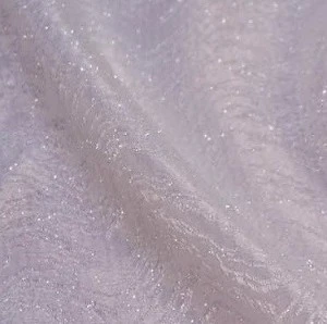 Shimmery lavender sparkle tulle fabric with delicate glitter texture for elegant event decor.