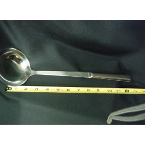 Stainless steel serving ladle with long handle, measuring approximately 11 inches on measuring tape.