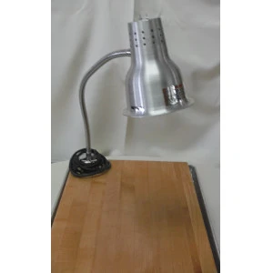 Silver adjustable heat lamp with flexible gooseneck mounted on black base near wooden cutting board.