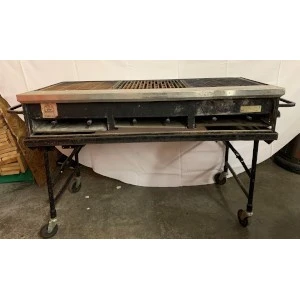 Large metal commercial propane grill on wheels with black grated cooking surface and multiple burners.