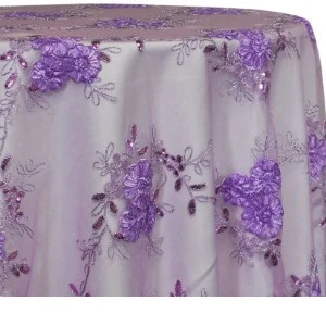 Lavender and white floral lace tablecloth with embroidered purple flowers and delicate vine pattern.