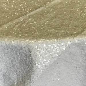 Textured white linen fabric with sequins for event rentals.